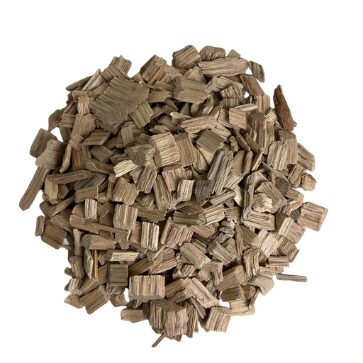 A pile of light toasted American Oak chips used for flavoring wine and mead