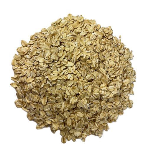 Circular pile of Flaked Oats, otherwise known as Rolled Oats, intended for brewing homemade beer.