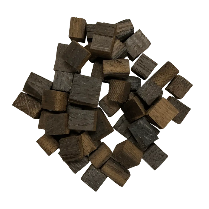 Pile of dark brown French Oak, Heavy toasted wooden cubes for wine, mead, cider, beer and spirits.
