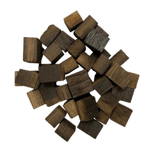Pile of dark brown French Oak, Medium toasted wooden cubes for wine, mead, cider, beer and spirits.