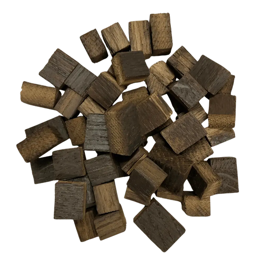 Pile of dark brown French Oak, Medium Plus toasted wooden cubes for wine, mead, cider, beer and spirits.