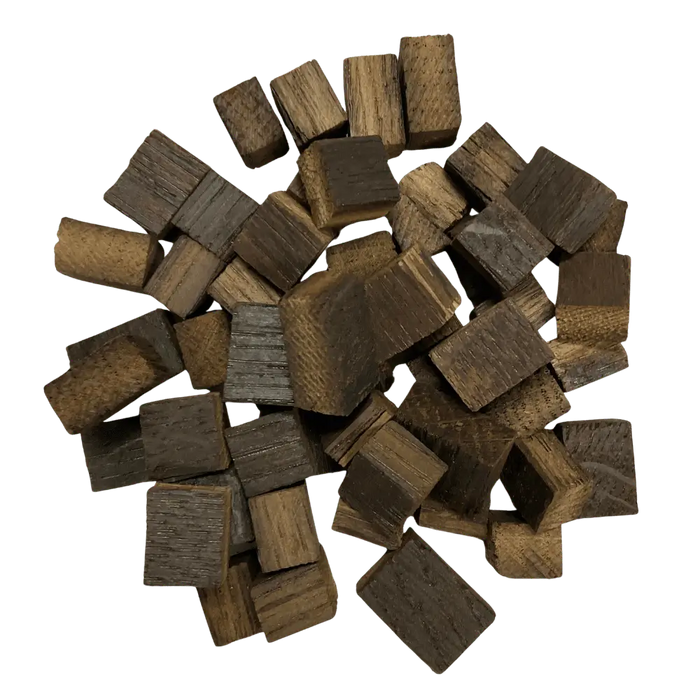Pile of dark brown French Oak, Medium Plus toasted wooden cubes for wine, mead, cider, beer and spirits.