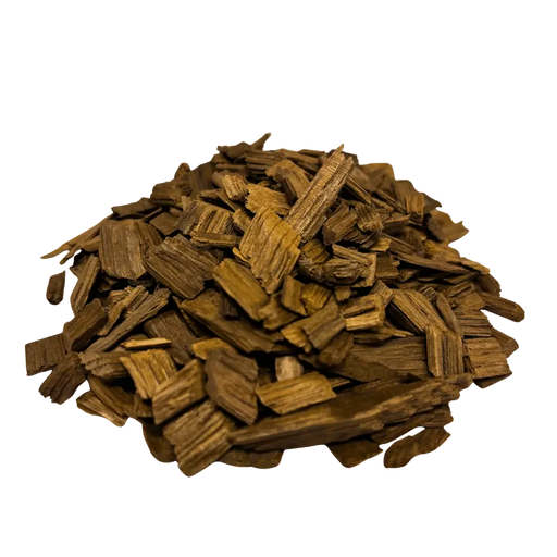 A pile of medium plus toasted French White Oak chips used for flavoring wine and mead, angled view.