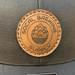 SoCal Brewing Supply Hat with Leather Laser Engraved Logo, the hat is all black in color, close up view.