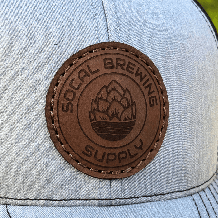 Gray cap with a brown leather patch featuring 'SOCAL BREWING SUPPLY' branding.