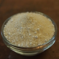 A clear glass bowl filled with Fermax Yeast Nutrient.